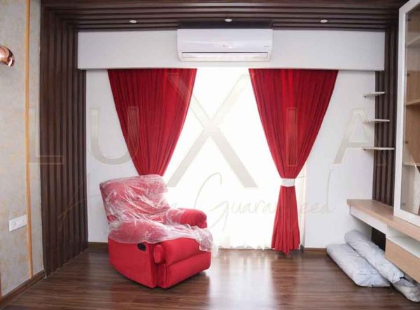 Vibrant and beautiful red sofa red curtains in living room design - LuXia LLP